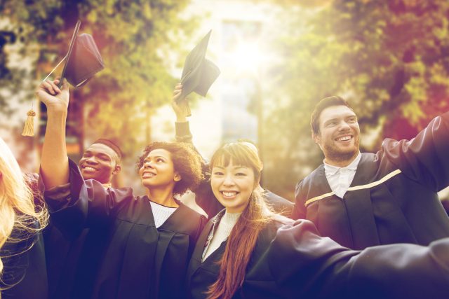 a group of people in graduation caps and gowns.